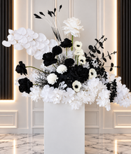 Load image into Gallery viewer, White arch backdrop, 2 x black & white flowers, 2 x black cylinder plinths - HIRE ONLY