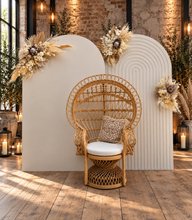 Load image into Gallery viewer, Two white backdrops / arches & 3 x boho flowers & Queen Peacock chair - HIRE ONLY