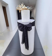 Load image into Gallery viewer, White cylinder plinth cake or flower stand - 90cm with bow - HIRE ONLY