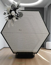Load image into Gallery viewer, Black hexagonal backdrop & flowers - HIRE ONLY