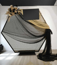 Load image into Gallery viewer, Black Hexagonal mesh backdrop and black & gold flowers - HIRE ONLY