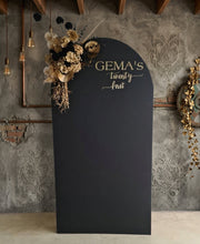 Load image into Gallery viewer, Black arch backdrop and black & gold flowers - HIRE ONLY