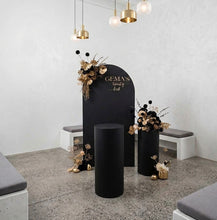 Load image into Gallery viewer, Black arch backdrop, 2 x black & gold flowers & 2 x black plinths - HIRE ONLY