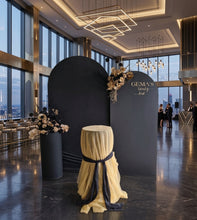 Load image into Gallery viewer, 2 x arch backdrop, 2 x black & gold flowers, 2 x black plinths - HIRE ONLY