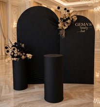 Load image into Gallery viewer, 2 x arch backdrop, 2 x black & gold flowers, 2 x black plinths - HIRE ONLY