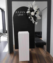 Load image into Gallery viewer, Black arch backdrop, Black & white flowers and white square ripple plinth / cake stand - HIRE ONLY