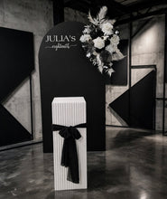 Load image into Gallery viewer, Black arch backdrop, Black & white flowers and white square ripple plinth / cake stand - HIRE ONLY