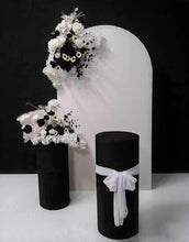 Load image into Gallery viewer, White arch backdrop, 2 x black & white flowers, 2 x black cylinder plinths - HIRE ONLY