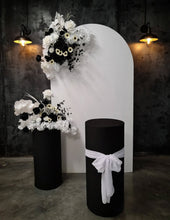 Load image into Gallery viewer, White arch backdrop, 2 x black & white flowers, 2 x black cylinder plinths - HIRE ONLY