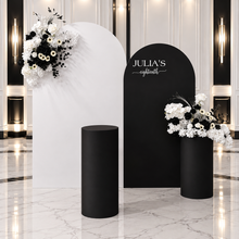 Load image into Gallery viewer, 2 x arch backdrop (black & white), 2 x black & white flowers, 2 x cylinder plinths - HIRE ONLY