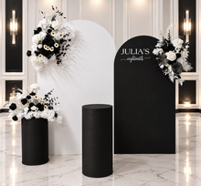 Load image into Gallery viewer, 2 x arch backdrop (black & white), 3 x black & white flowers, 2 x cylinder plinths - HIRE ONLY