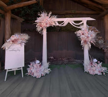 Load image into Gallery viewer, White wood arbour & 5 x Boho blush romantic flowers and easel - HIRE ONLY