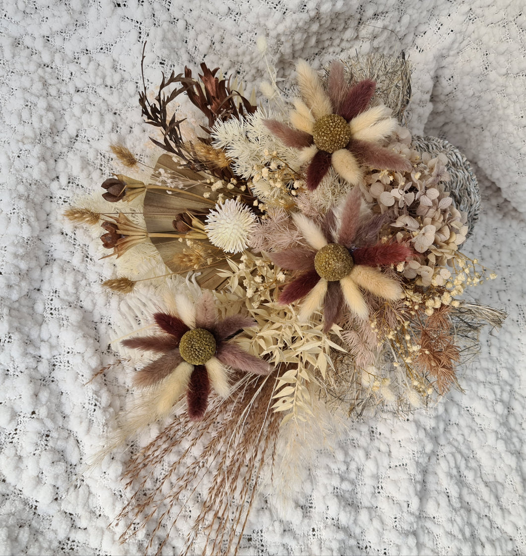 Boho hippie everlasting flowers in wicker pot