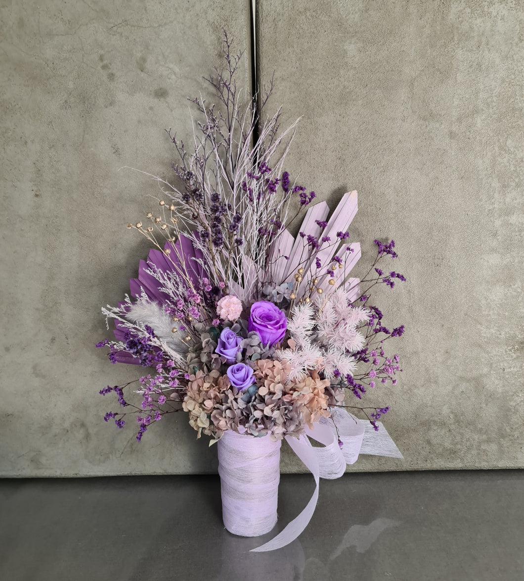 Glorious purple tone flower arrangement w preserved roses