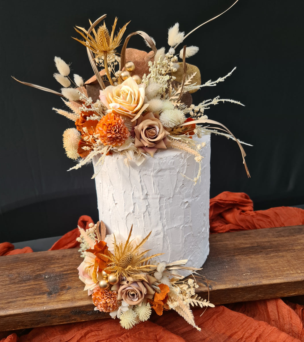 Everlasting flowers cake topper in rustic warm tones