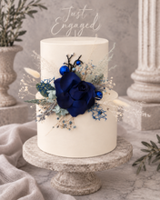 Load image into Gallery viewer, Floral cake topper in blue, green &amp; white with the glitter
