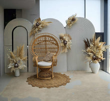 Load image into Gallery viewer, Three white backdrops / arches &amp; 5 x boho flowers &amp; Queen Peacock chair - HIRE ONLY

