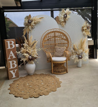 Load image into Gallery viewer, Two white backdrops / arches &amp; 5 x boho flowers &amp; Queen Peacock chair - HIRE ONLY
