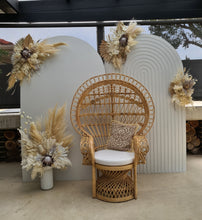 Load image into Gallery viewer, Two white backdrops / arches &amp; 5 x boho flowers &amp; Queen Peacock chair - HIRE ONLY
