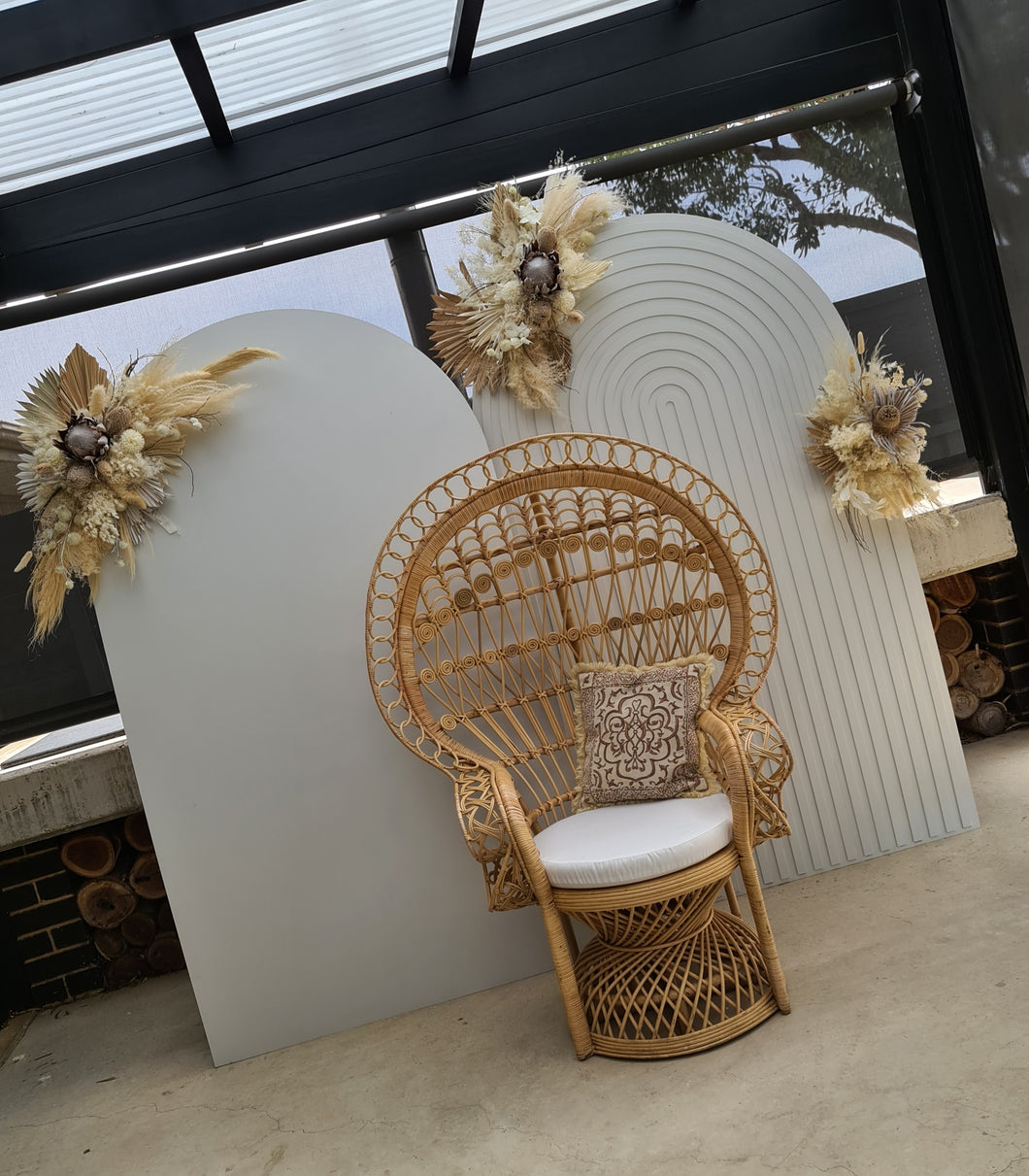 Two white backdrops / arches & 3 x boho flowers & Queen Peacock chair - HIRE ONLY