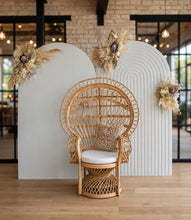 Load image into Gallery viewer, Two white backdrops / arches &amp; 3 x boho flowers &amp; Queen Peacock chair - HIRE ONLY
