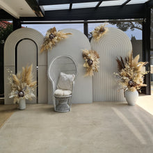 Load image into Gallery viewer, Two white backdrops / arches &amp; 5 x boho flowers &amp; White peacock chair - HIRE ONLY
