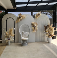 Load image into Gallery viewer, Two white backdrops / arches &amp; 5 x boho flowers &amp; White peacock chair - HIRE ONLY
