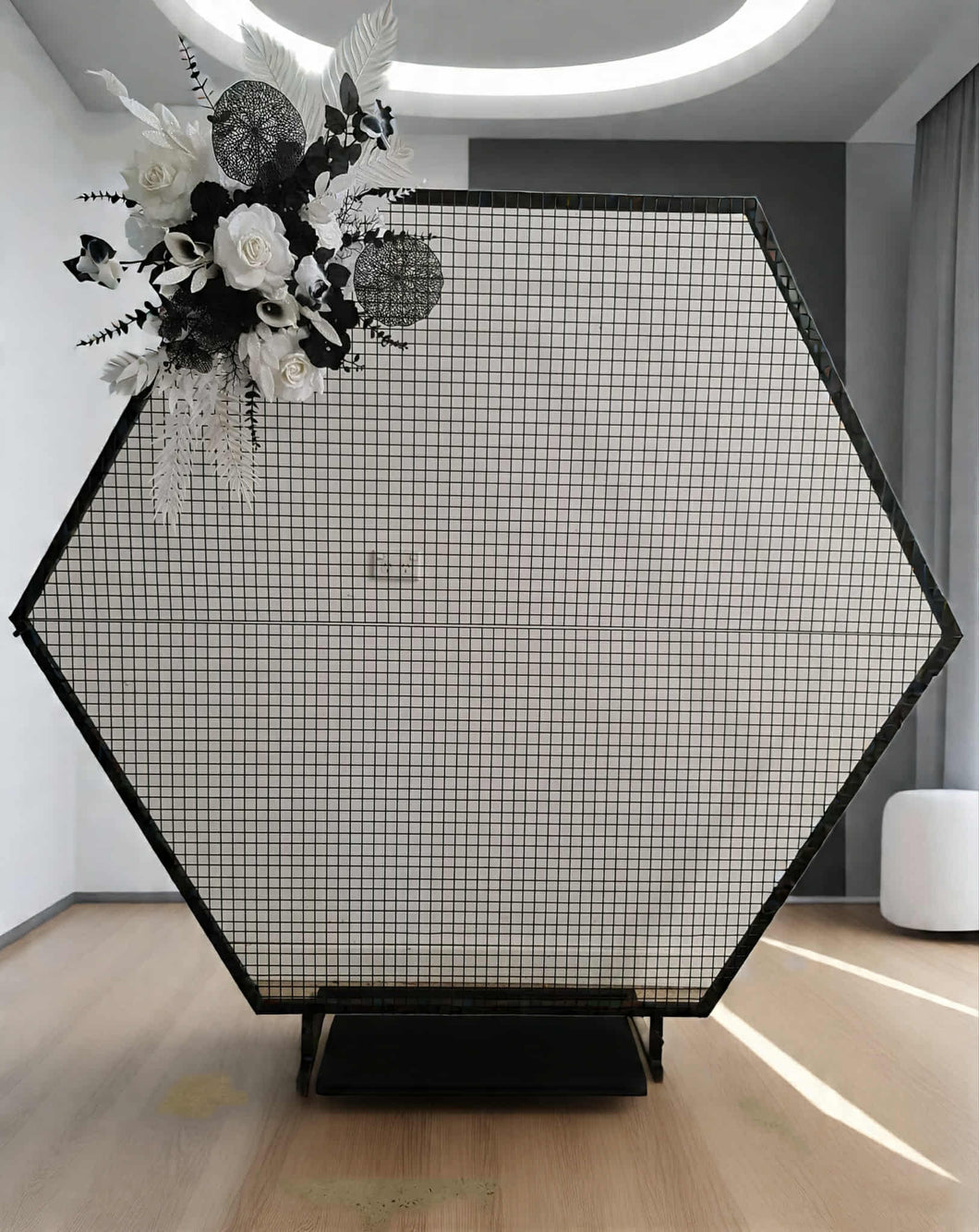 Black hexagonal backdrop & flowers - HIRE ONLY