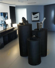 Load image into Gallery viewer, Set of 3 Black Cylinder Plinths – Grooms Preparation Room - HIRE ONLY
