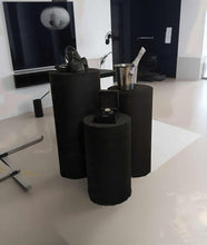 Load image into Gallery viewer, Set of 3 Black Cylinder Plinths – Grooms Preparation Room - HIRE ONLY
