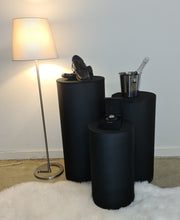 Load image into Gallery viewer, Set of 3 Black Cylinder Plinths – Grooms Preparation Room - HIRE ONLY
