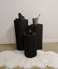 Load image into Gallery viewer, Set of 3 Black Cylinder Plinths – Grooms Preparation Room - HIRE ONLY
