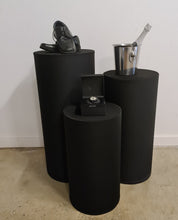 Load image into Gallery viewer, Set of 3 Black Cylinder Plinths – Grooms Preparation Room - HIRE ONLY
