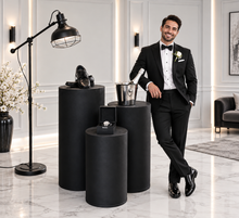 Load image into Gallery viewer, Set of 3 Black Cylinder Plinths – Grooms Preparation Room - HIRE ONLY

