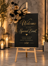 Load image into Gallery viewer, Black &amp; Gold Welcome sing - Flowers &amp; Easel - HIRE ONLY
