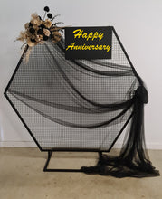 Load image into Gallery viewer, Black Hexagonal mesh backdrop and black &amp; gold flowers - HIRE ONLY

