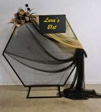 Load image into Gallery viewer, Black Hexagonal mesh backdrop and black &amp; gold flowers - HIRE ONLY
