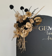 Load image into Gallery viewer, Black arch backdrop and black &amp; gold flowers - HIRE ONLY
