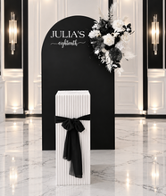 Load image into Gallery viewer, Black arch backdrop, Black &amp; white flowers and white square ripple plinth / cake stand - HIRE ONLY
