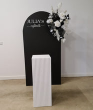 Load image into Gallery viewer, Black arch backdrop, Black &amp; white flowers and white square ripple plinth / cake stand - HIRE ONLY

