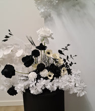Load image into Gallery viewer, White arch backdrop, 2 x black &amp; white flowers, 2 x white square ripple plinths - HIRE ONLY
