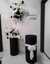 Load image into Gallery viewer, White arch backdrop, 2 x black &amp; white flowers, 2 x black cylinder plinths - HIRE ONLY
