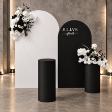 Load image into Gallery viewer, 2 x arch backdrop (black &amp; white), 2 x black &amp; white flowers, 2 x cylinder plinths - HIRE ONLY
