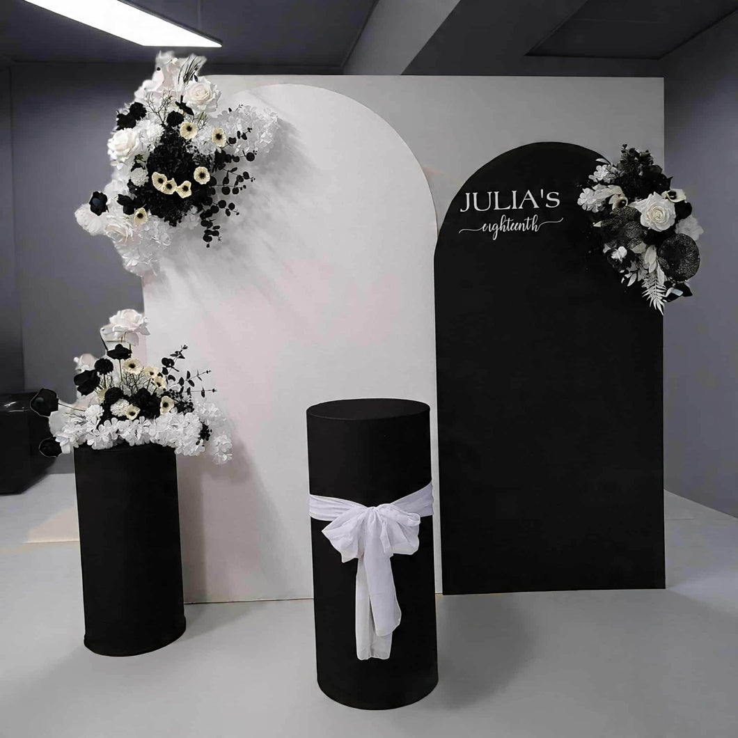 2 x arch backdrop (black & white), 3 x black & white flowers, 2 x cylinder plinths - HIRE ONLY