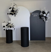 Load image into Gallery viewer, 2 x arch backdrop (black &amp; white), 3 x black &amp; white flowers, 2 x cylinder plinths - HIRE ONLY
