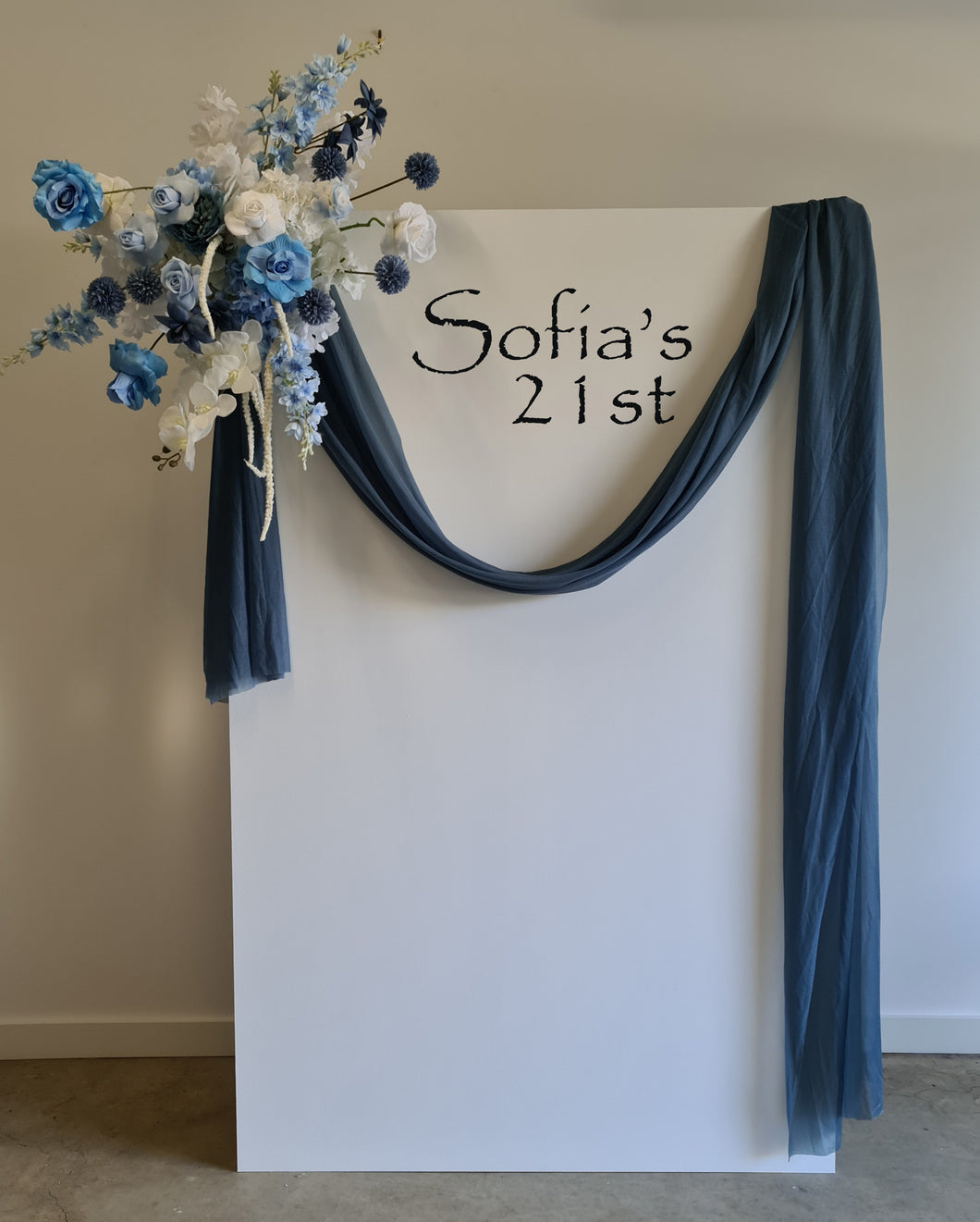 White rectangular backdrop 2.1m & blue flowers - HIRE ONLY