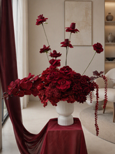 Load image into Gallery viewer, Burgundy floor / plinth flowers in white ribbed pot - HIRE OLY
