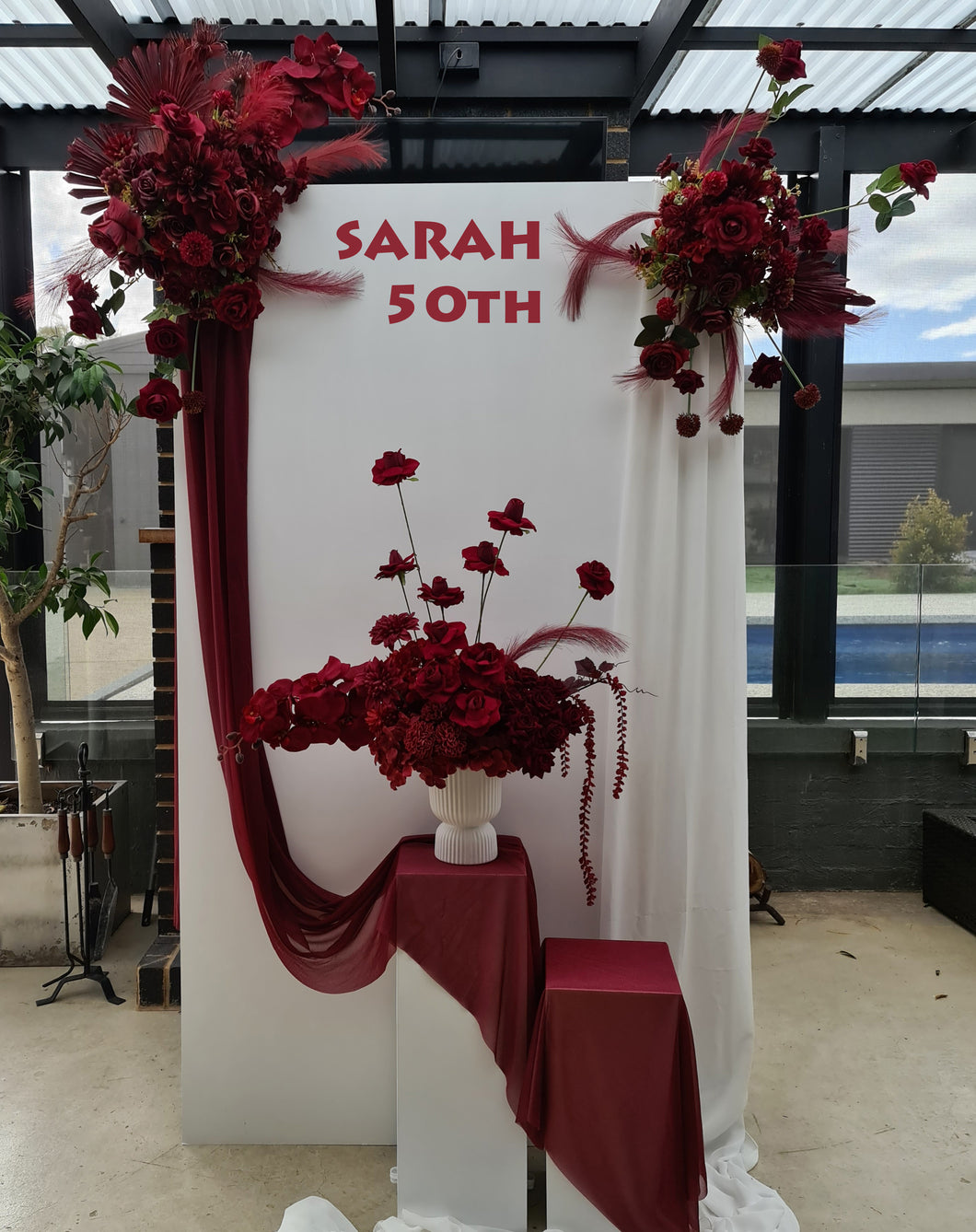 Rectangular backdrop, 3 x burgundy (dark red) flowers - HIRE ONLY