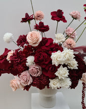 Load image into Gallery viewer, Burgundy, pink &amp; white floor / plinth flowers in white ribbed pot - HIRE ONLY
