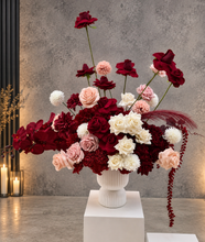 Load image into Gallery viewer, Burgundy, pink &amp; white floor / plinth flowers in white ribbed pot - HIRE ONLY
